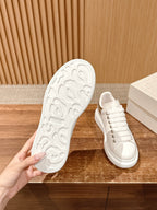 Alexander McQueen sneaker outsole with textured tread and white rubber finish