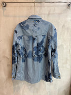 Long-sleeve shirt back view in light blue with dark blue motif print and button closure