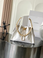 White quilted leather Chanel shoulder bag with gold chain strap and top handle