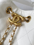 Gold-tone chain and hardware detail on white quilted leather bag