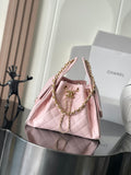 Pink quilted leather Chanel mini bag with gold chain handles