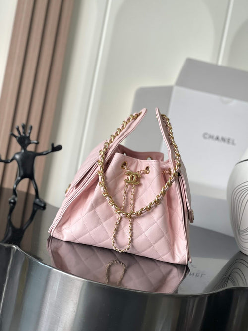 Pink quilted leather Chanel mini bag with gold chain handles