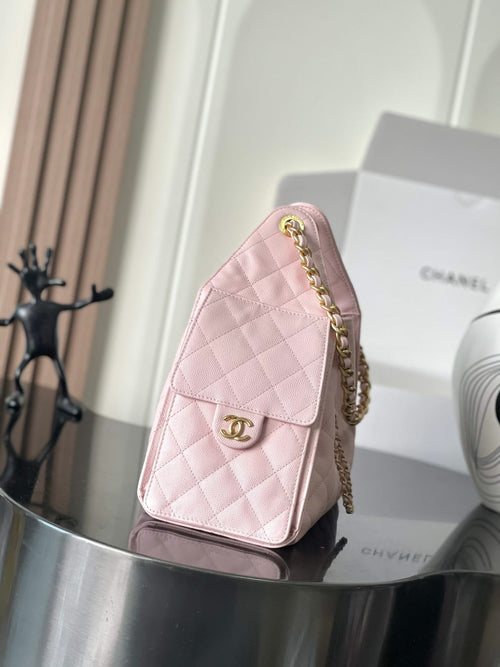 Pink quilted Chanel flap shoulder bag with gold-tone chain and logo turn-lock
