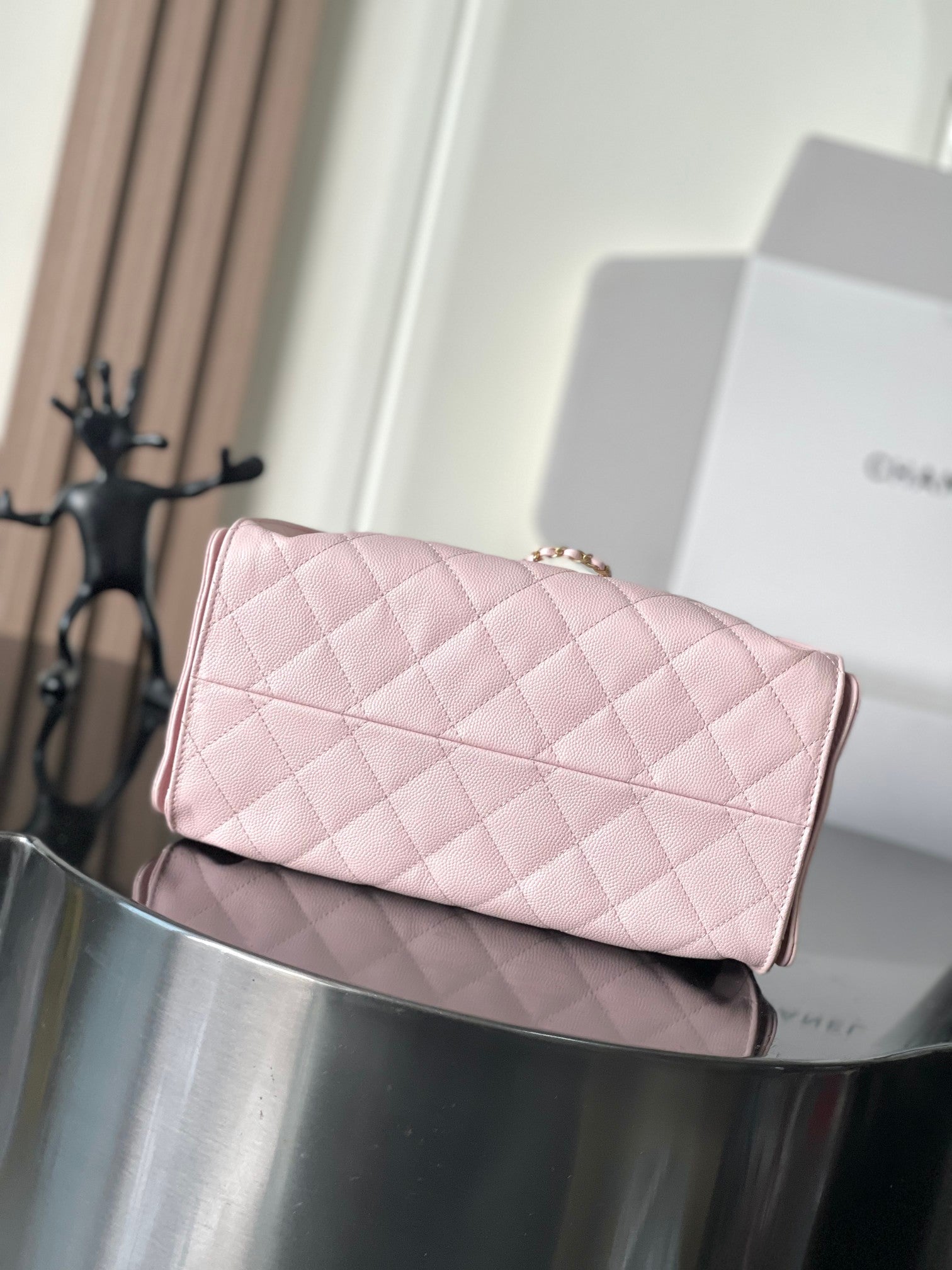 Pink quilted leather Chanel flap bag with gold-tone chain, rectangular shape