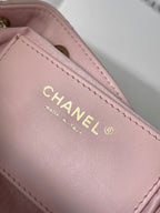 Pink leather Chanel label with CHANEL and MADE IN ITALY text
