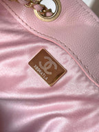Chanel pink leather bag with gold logo hardware and interior label