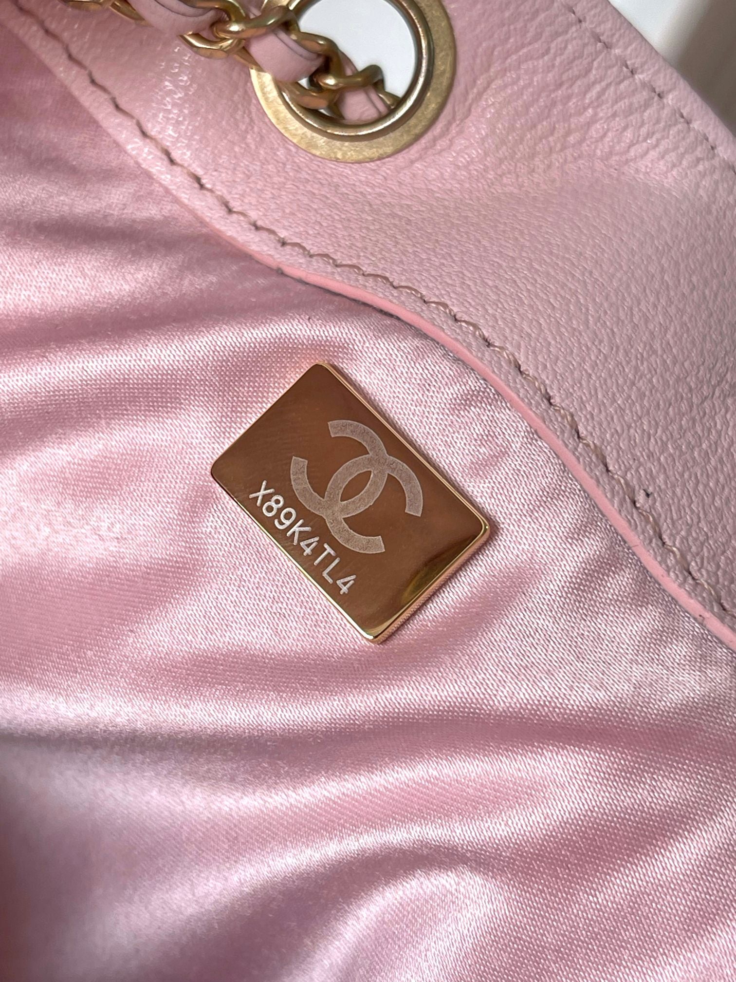 Chanel pink leather bag with gold logo hardware and interior label
