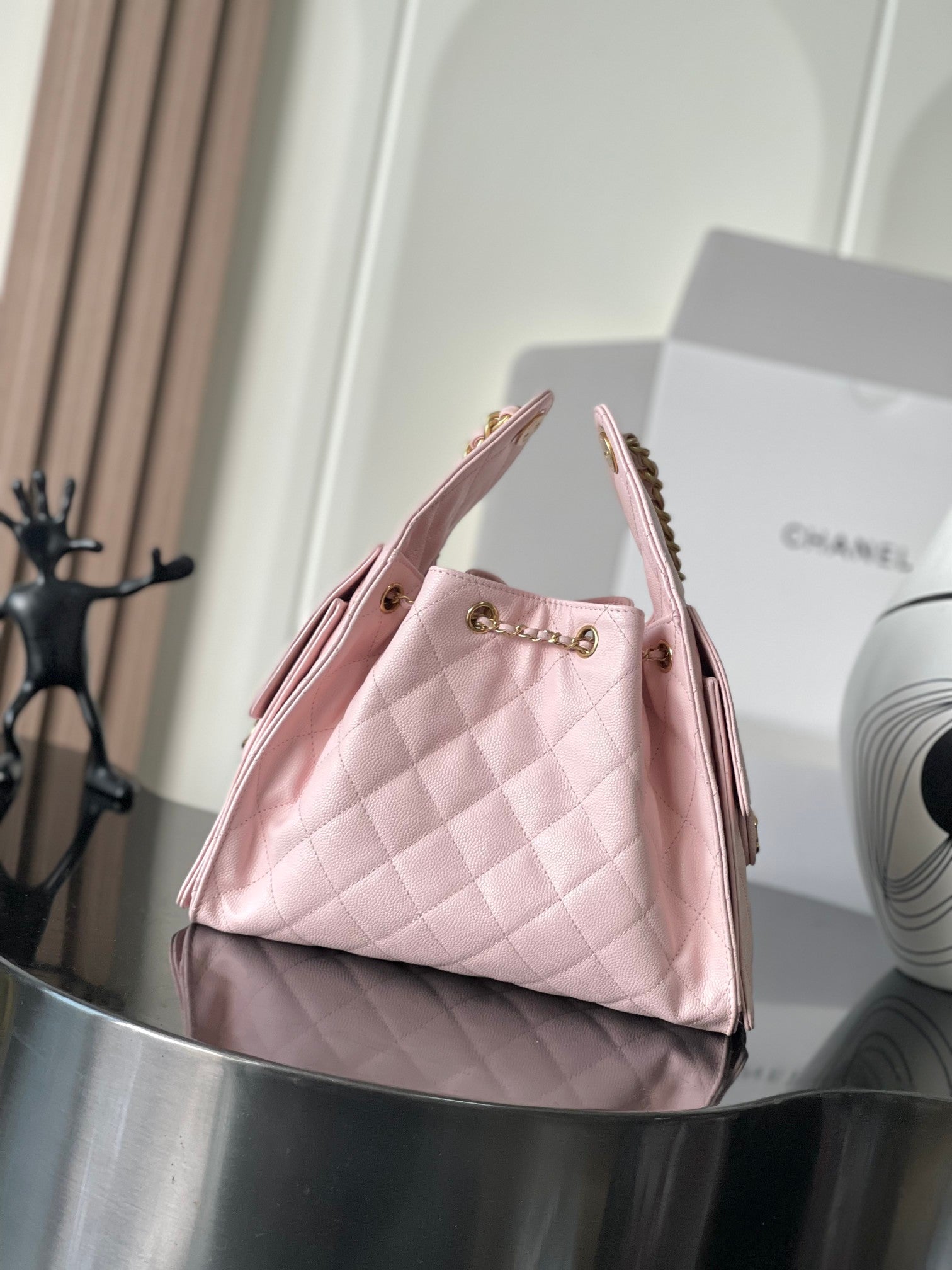 Pink quilted leather Chanel mini tote bag with gold chain shoulder strap