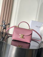 Pink leather Celine handbag with top handle and gold tone logo clasp