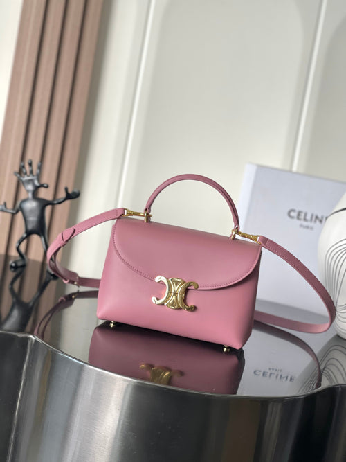 Pink leather Celine handbag with top handle and gold tone logo clasp