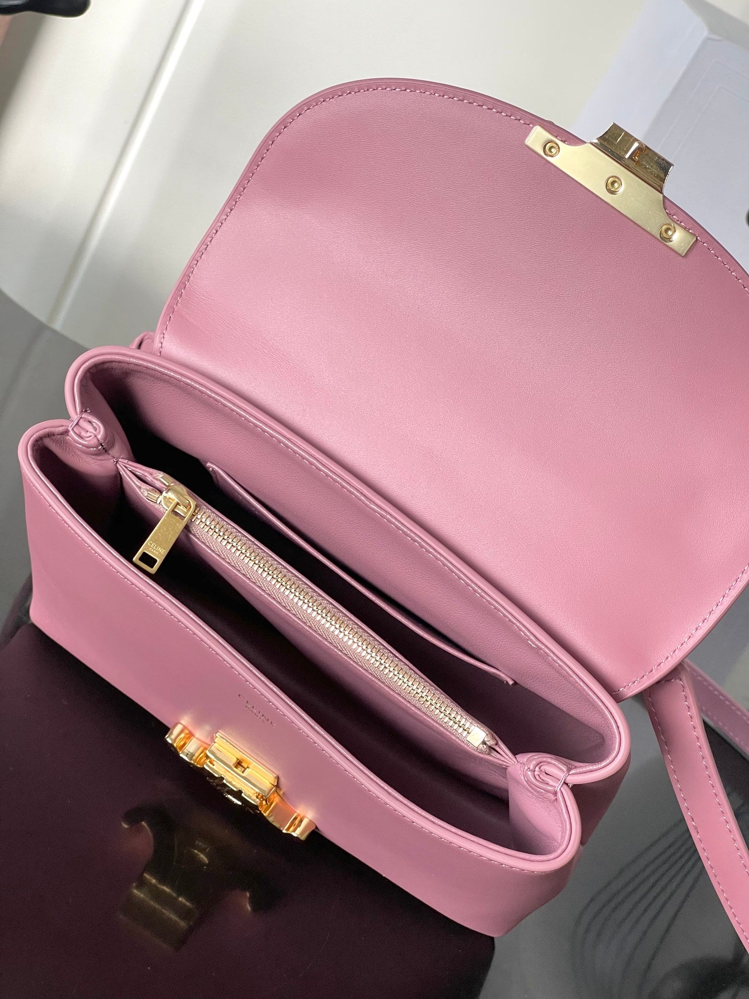 Pink leather Celine handbag with open top and interior zipper pocket