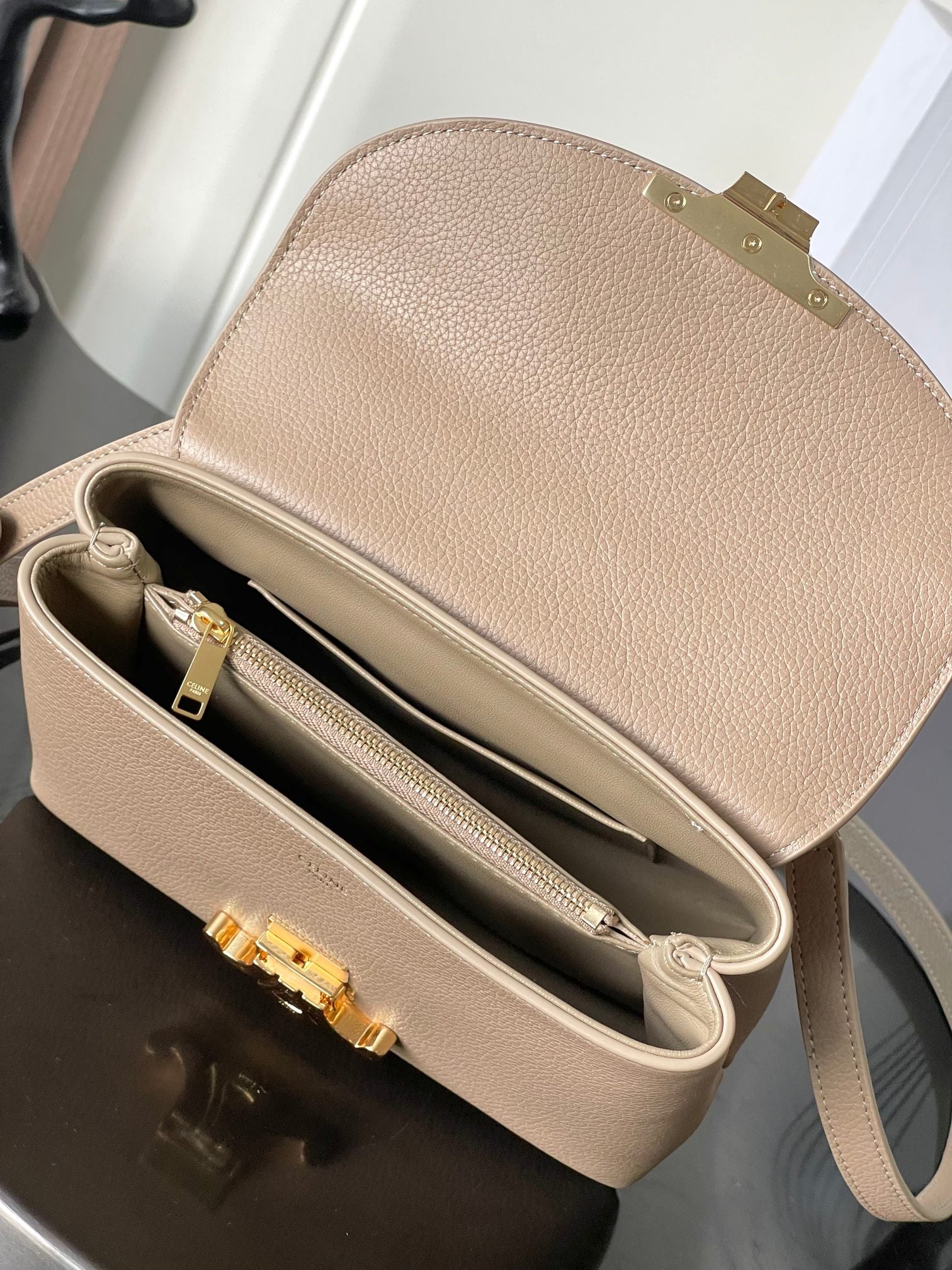 Celine beige small bag interior view with double zip compartments