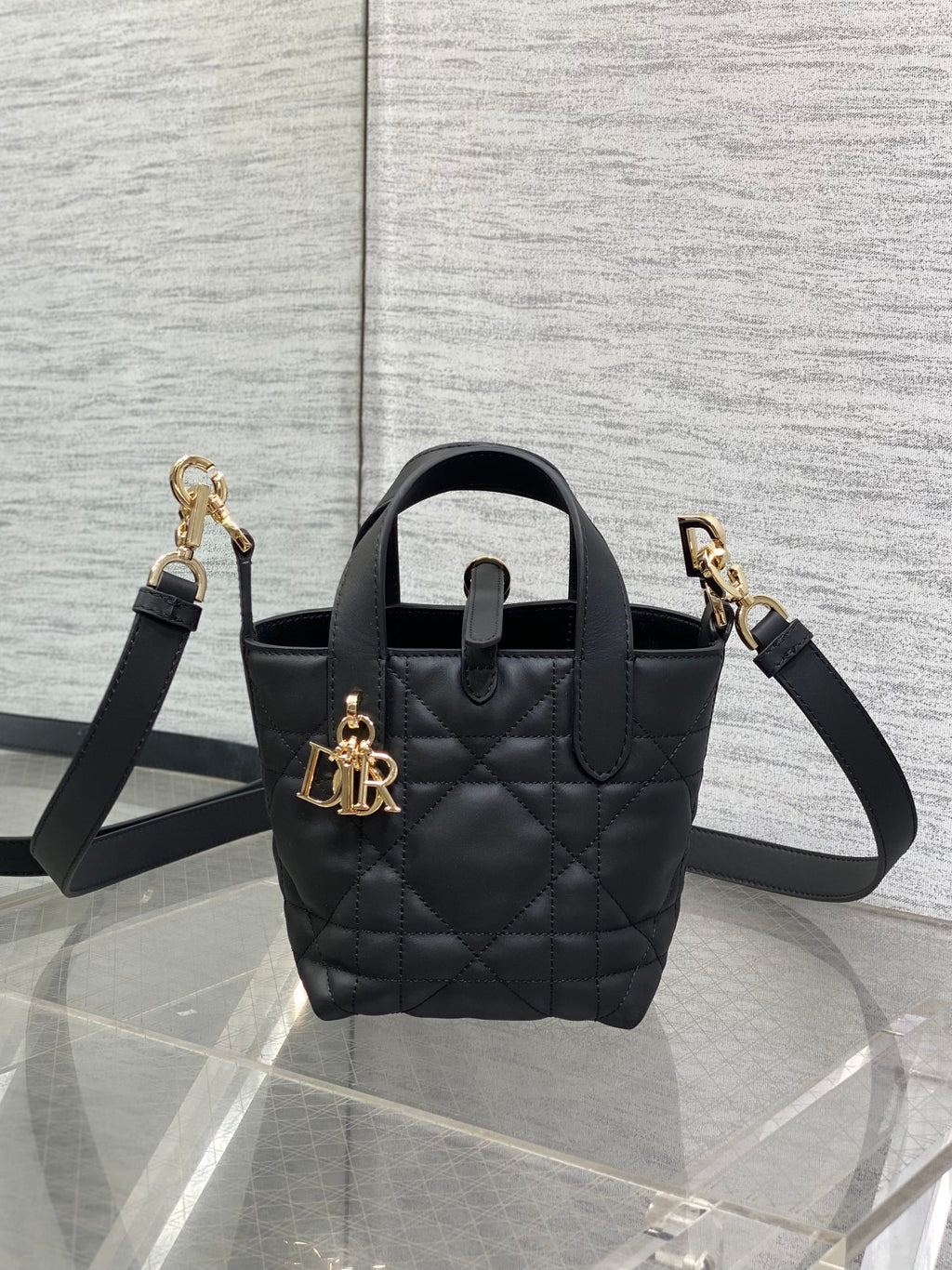 Black quilted leather Dior mini tote bag with top handle and gold-tone hardware