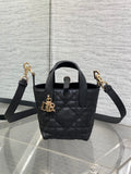 Black quilted leather Dior mini tote bag with top handle and gold-tone hardware