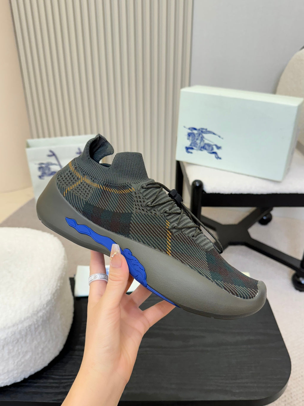 Burberry knit sneaker with blue outsole edge and textured patterned upper