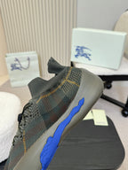 Burberry lace-up knit sneaker with blue heel detail and patterned upper