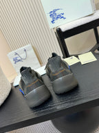 Burberry knit sneakers with blue heel accents, rear view