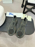Burberry knit sneakers in dark gray with blue outsole, lace-up front