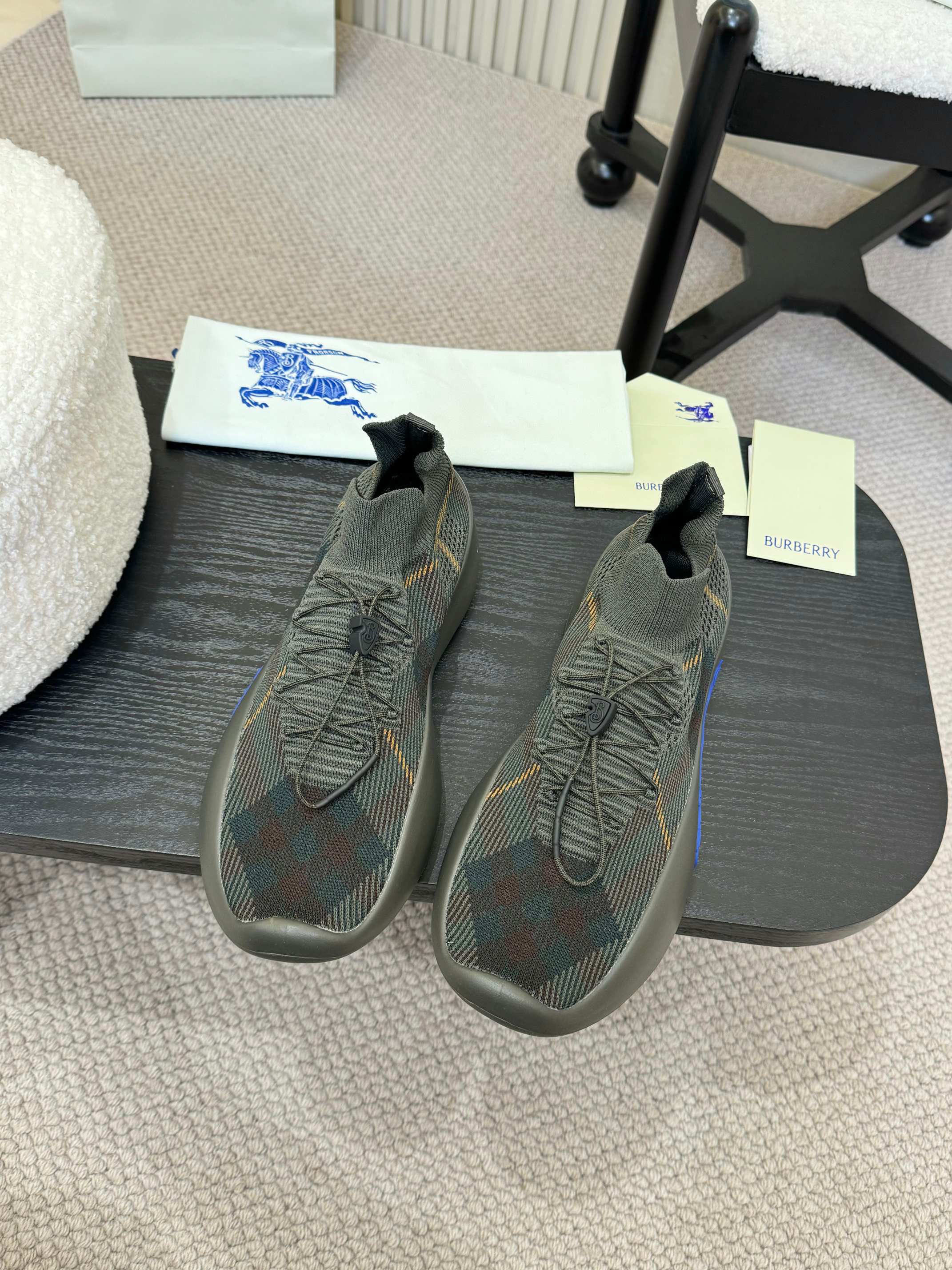 Burberry knit sneakers in dark gray with blue outsole, lace-up front