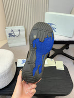 Burberry sneaker outsole with blue traction tread and dark rubber base