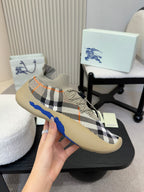 Beige checked slip-on sneaker with blue stripe and contrast laces detail, held up.