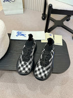Black and white check knit slip-on sneakers with blue-accent soles