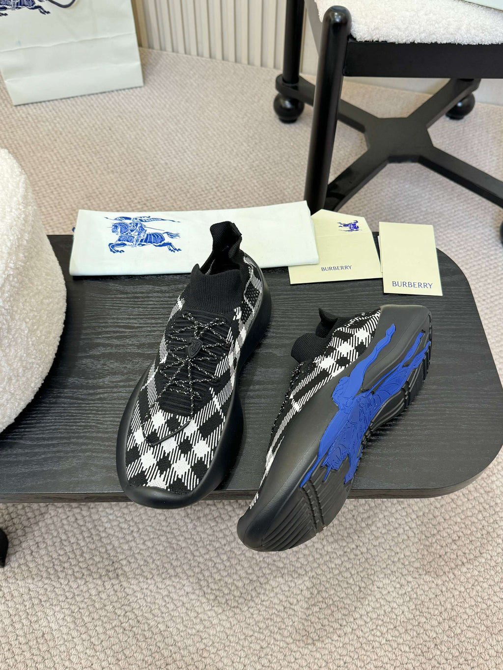 Black and white check knit slip-on sneakers with blue sole detail