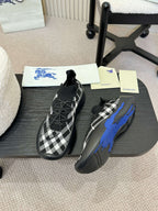 Black and white check knit slip-on sneakers with blue sole detail