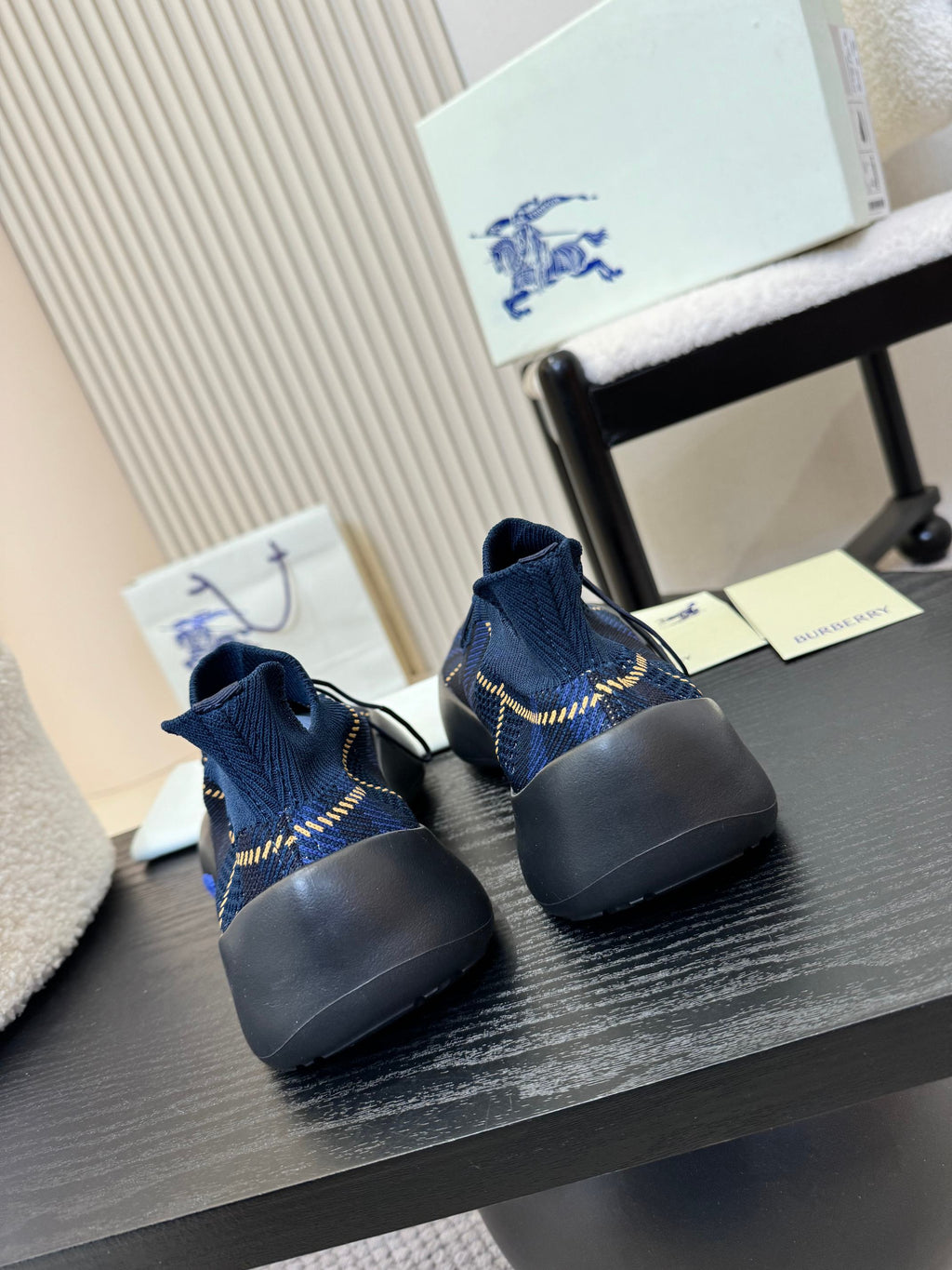 Burberry blue knit slip-on sneakers, heel view, blue sole and yellow stitching