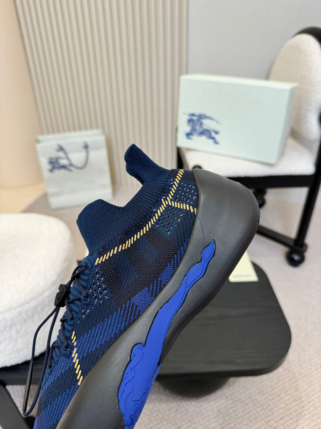 Burberry blue knit slip-on sneaker, front side view, plaid pattern, blue sole