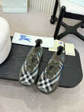 Pair of black and white checkered knit sneakers with blue trim and elastic collar