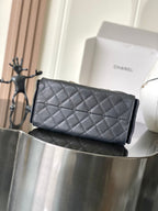 Chanel quilted leather clutch bag, dark gray with stitched diamond pattern