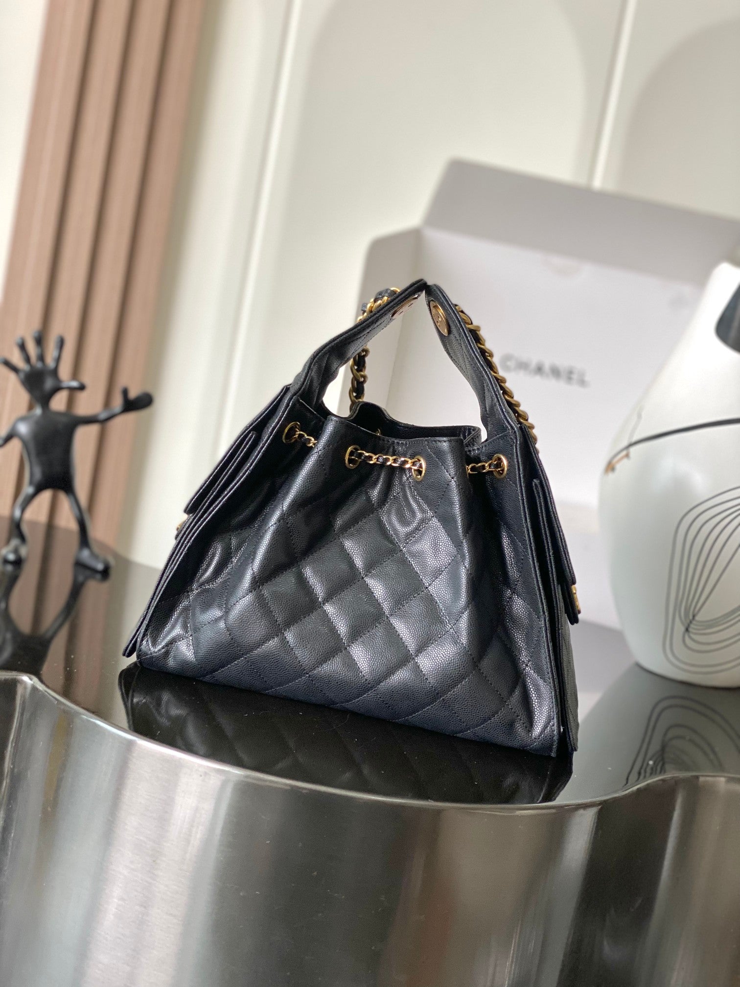 Chanel quilted leather hobo bag with gold chain shoulder strap and top handles