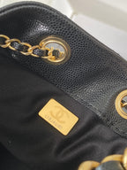 Chanel dark gray leather bag side with gold chain and gold logo plate