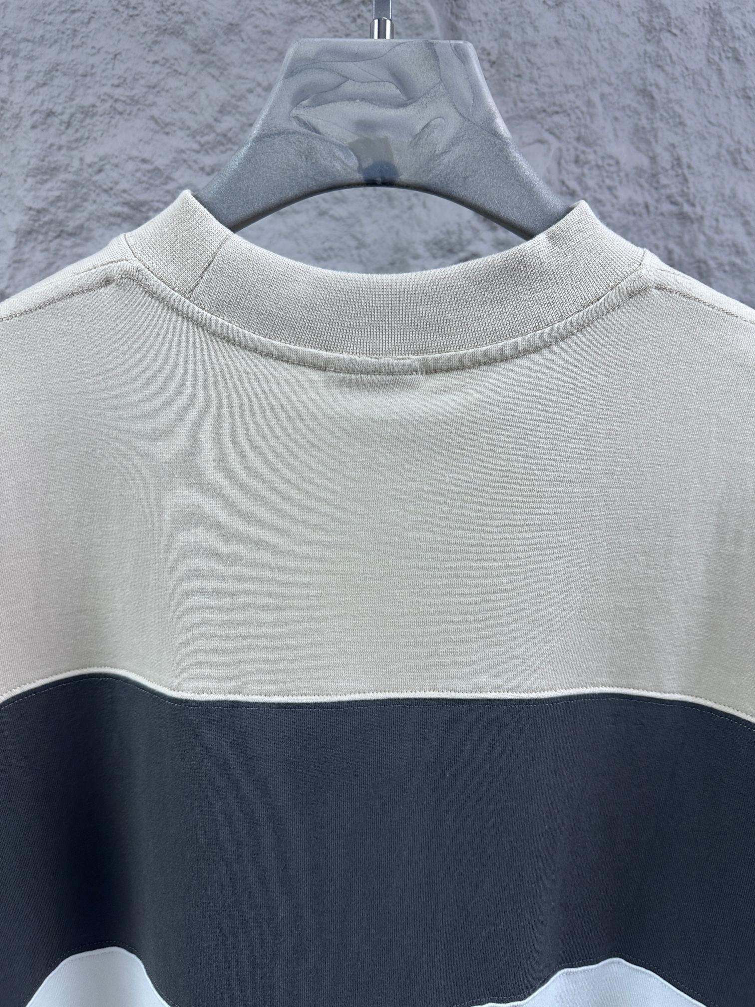 Crewneck T-shirt with color-block stripe, cream upper and navy band, no visible logo