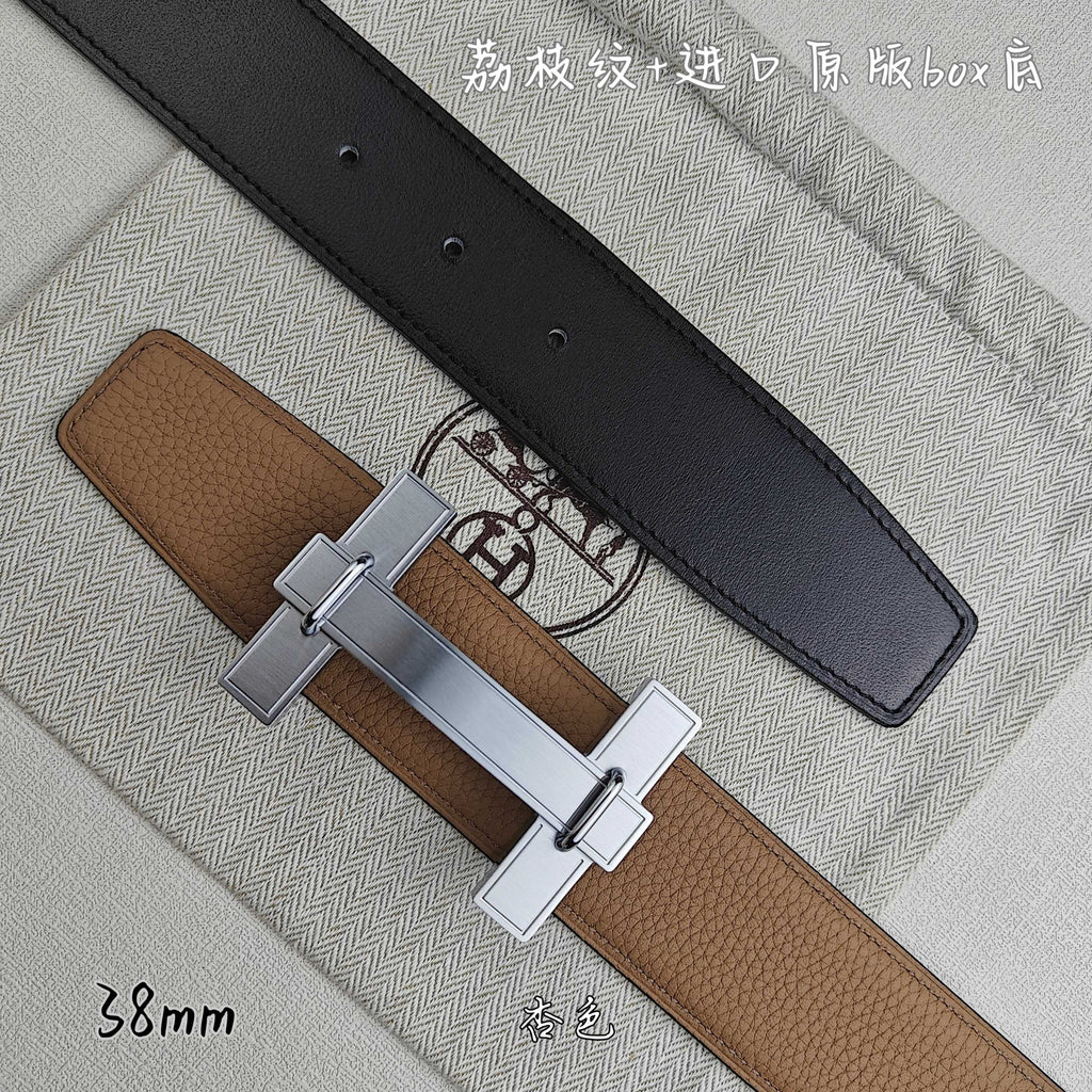 Belt with tan leather strap and black keeper, silver square buckle, top view