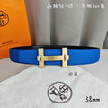 Blue leather Hermes belt with gold rectangular buckle, 38 mm width.
