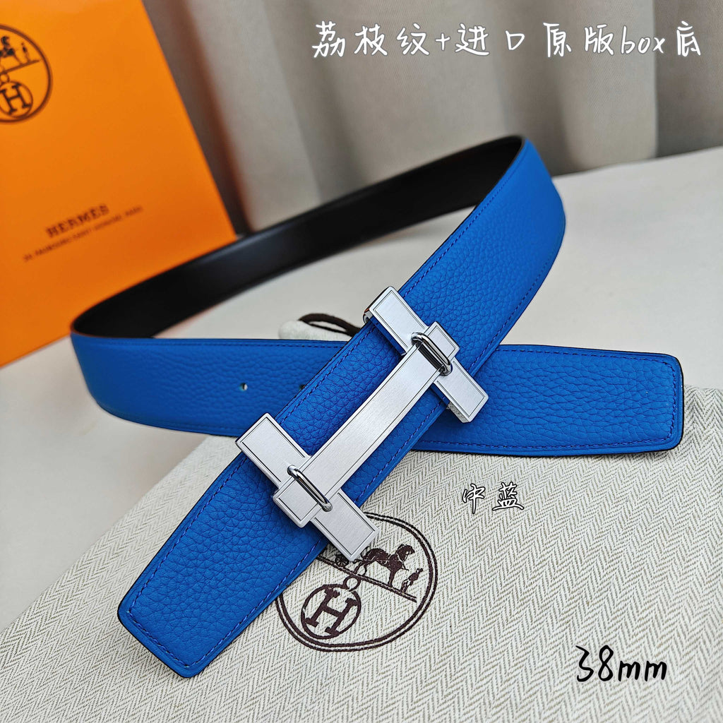 Blue leather Hermes belt with silver buckle, angled close-up.