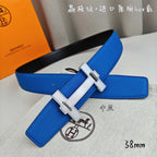 Blue leather Hermes belt with silver buckle, angled close-up.