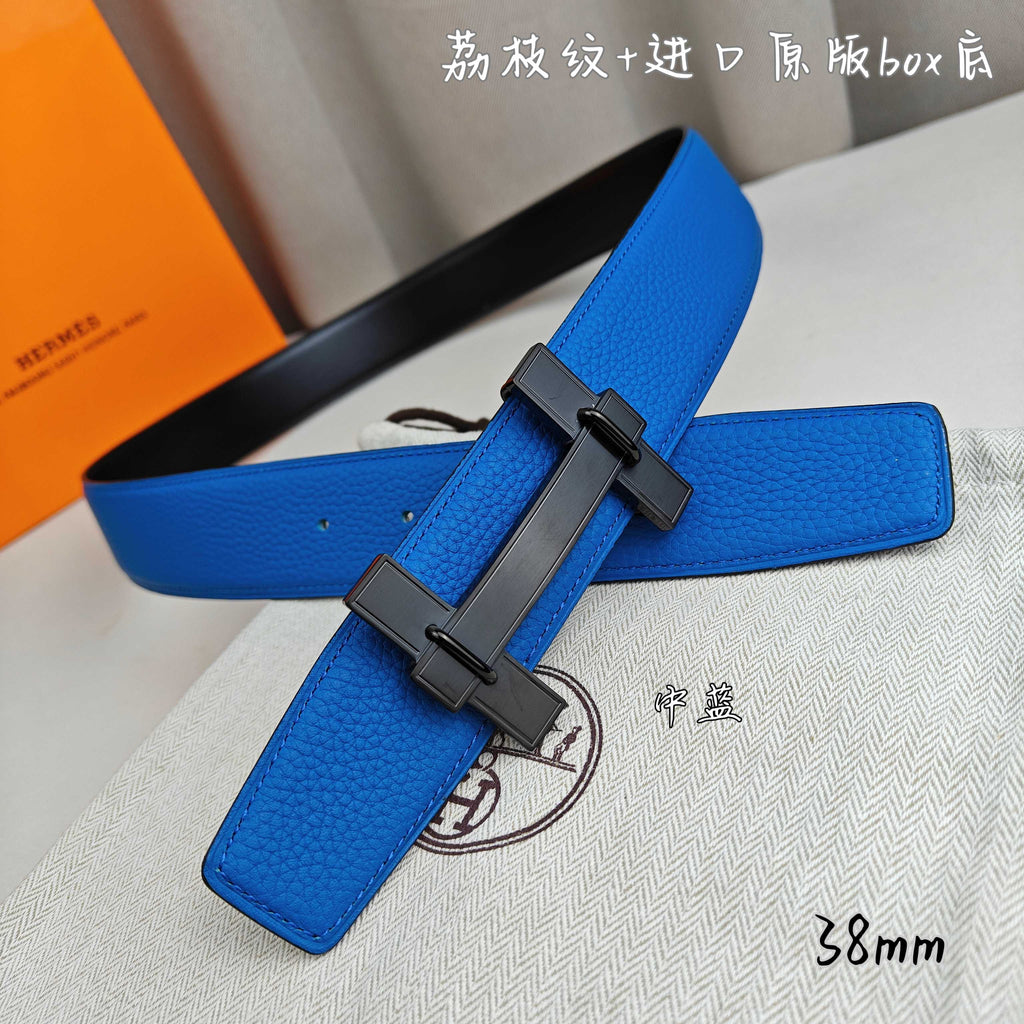 Blue leather Hermes belt with black buckle, angled close-up.