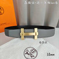Light gray leather belt with gold-tone rectangular buckle and keeper