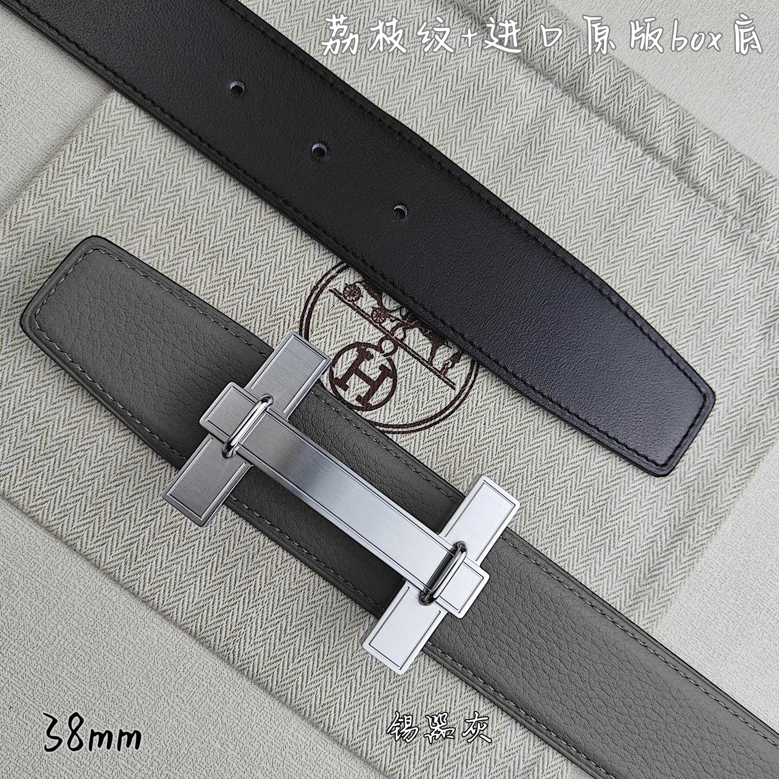 Dark gray leather belt with silver-tone rectangular buckle and keeper loops