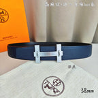 Blue leather belt with silver-tone H buckle and keeper.