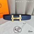 Hermes belt in textured blue leather with gold-tone H buckle.