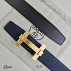 Blue and black leather belts with gold-tone H buckle, side view.