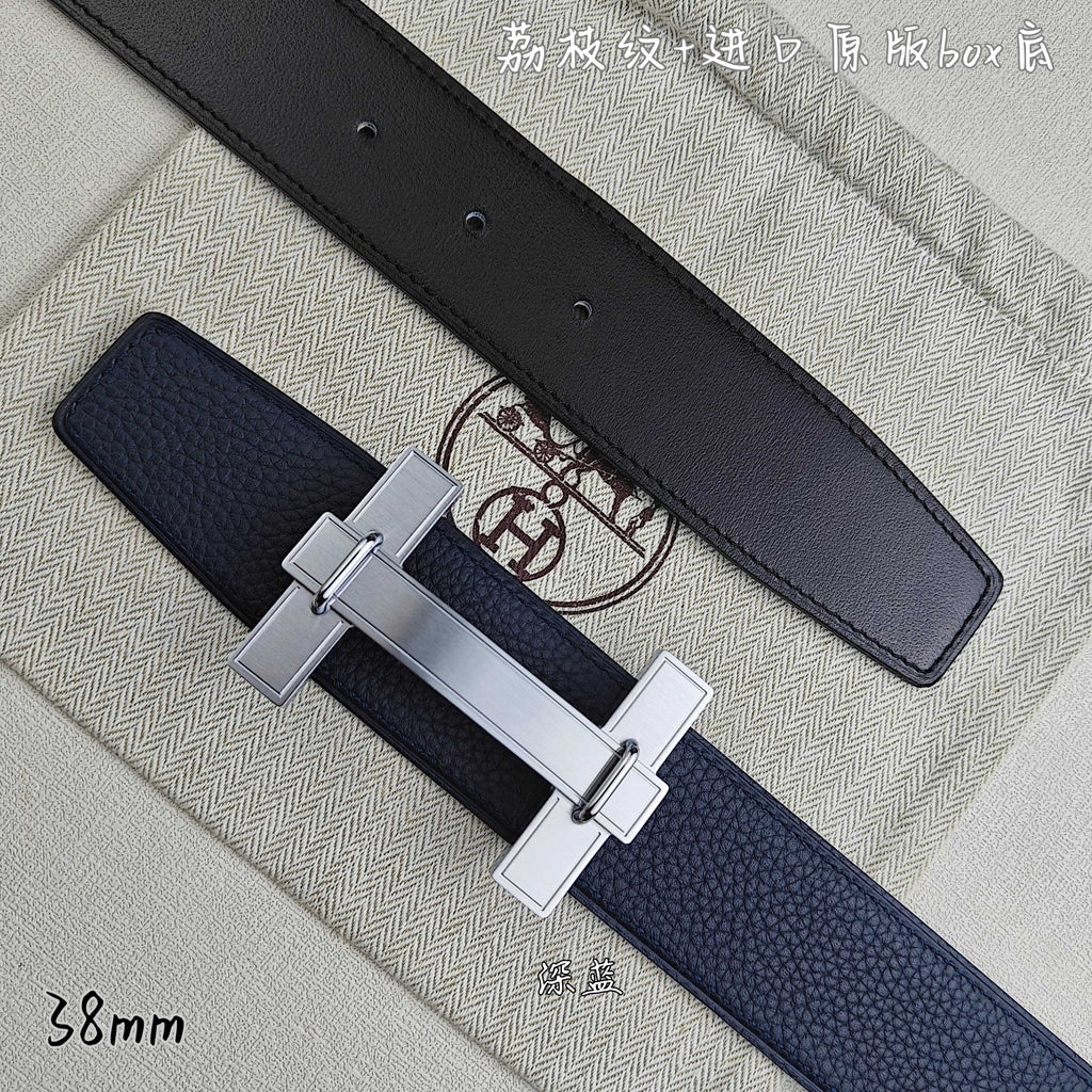 Blue and black leather belts with silver-tone H buckle, close-up side view.