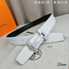 White leather belt with silver-tone buckle and long strap keeper.