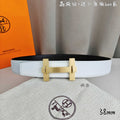 White leather belt with gold-tone rectangular buckle and double-bar frame.