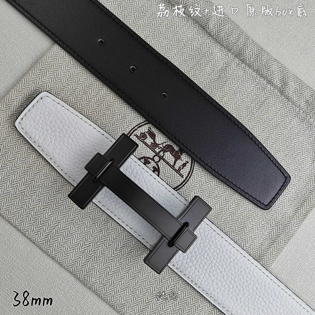 White leather belt with black keeper strap and black-tone rectangular buckle.
