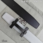 White leather belt with black keeper strap and black-tone rectangular buckle.